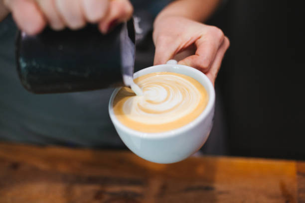istock Barista Pouring Latte Art 860121374