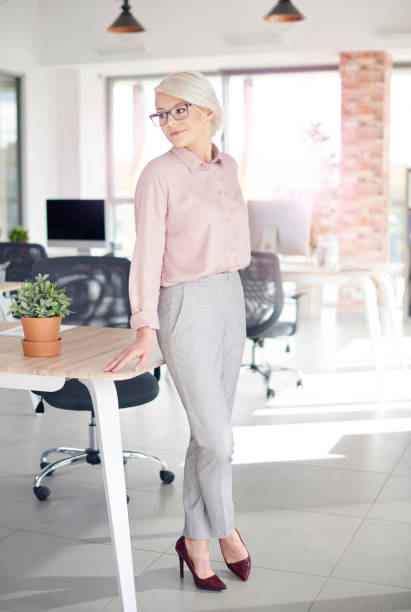 istock Business person leaning against office desk 860121820
