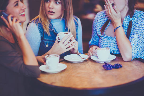 istock Female friends talking in cafe 860122060