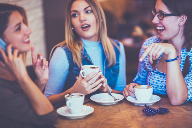 istock Female friends talking in cafe 860122438