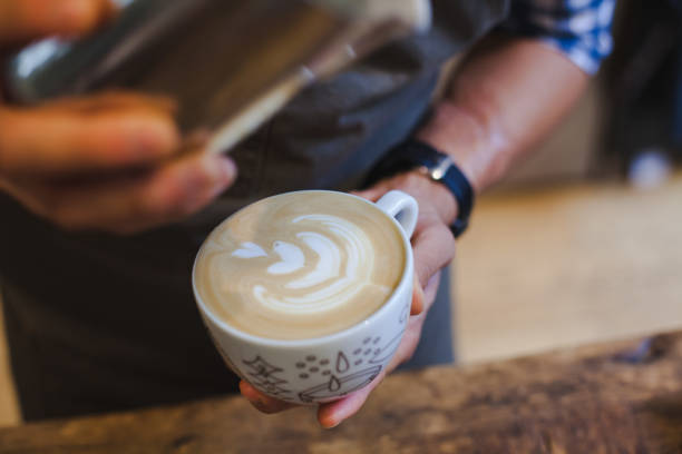 istock Barista Pouring Latte Art 860122836