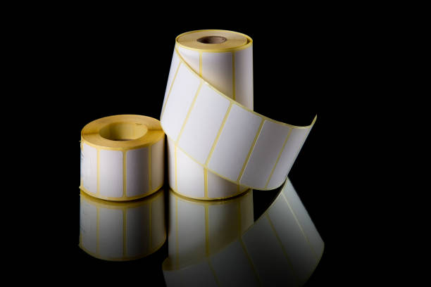 istock Rolls of white labels, isolated on black background. 860123614