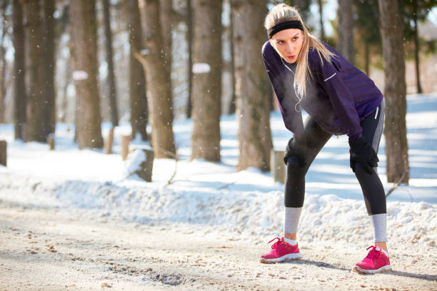istock sporty woman on break after running 860125438