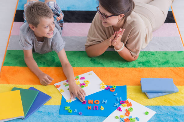istock Smiling teacher and child 860126578