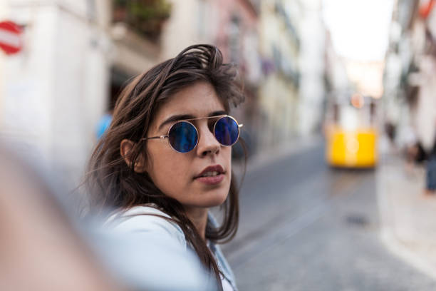 istock Solo traveler in Lisbon taking a Selfie with Old Tram 860128954