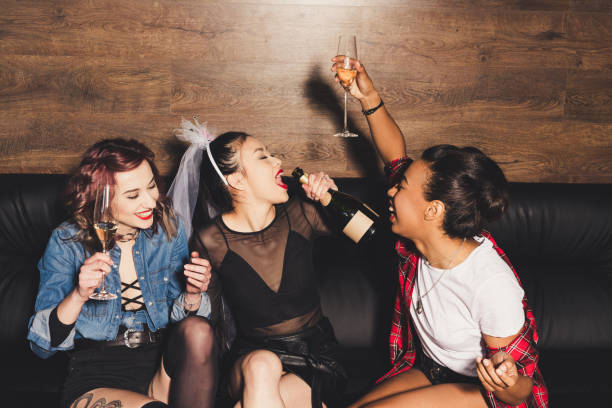 istock multicultural women having fun at hen party 860129408
