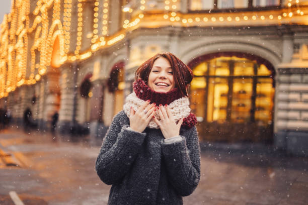 Woman on the street decorated for Christmas stock photo