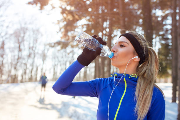 istock Girl drinks water on training outdoor 860129824
