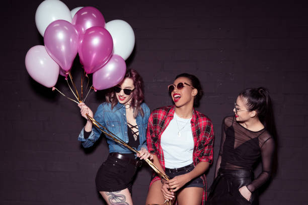istock multicultural women with balloons 860133388