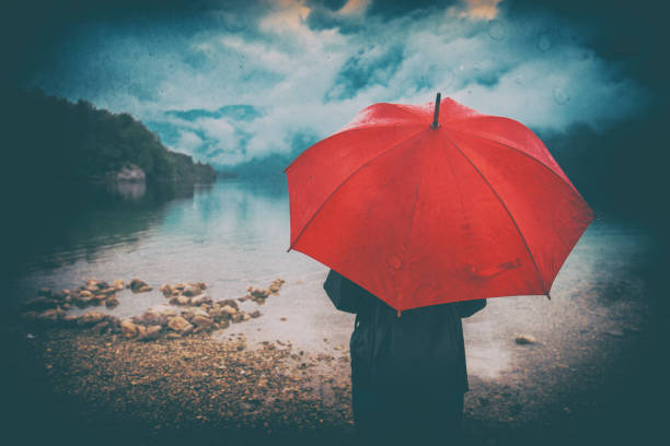 istock Woman with red umbrella 860133642