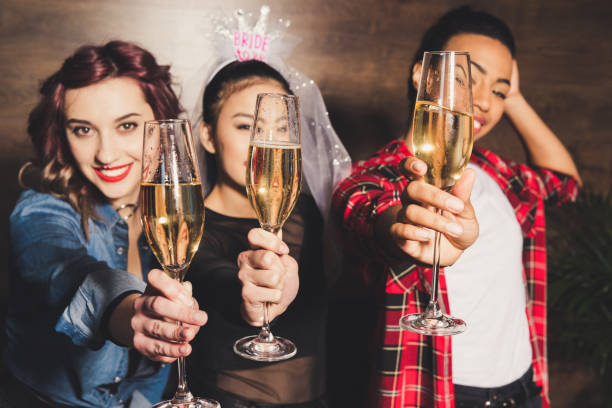 istock multicultural women with champagne at hen party 860136226