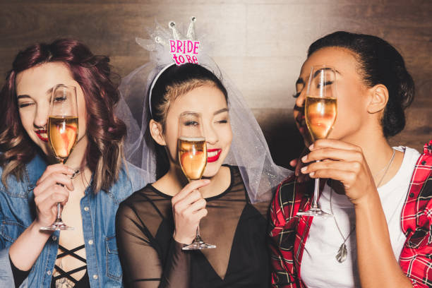 istock multicultural women with champagne at hen party 860136376
