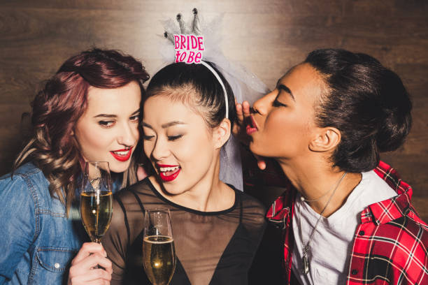 istock multicultural women with champagne at hen party 860136850