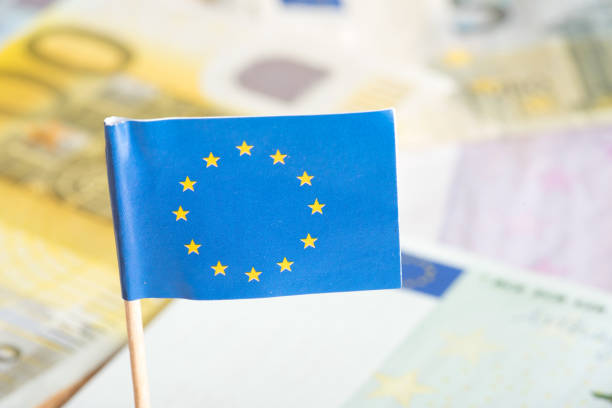 istock An EU flag and euro banknotes 860137264
