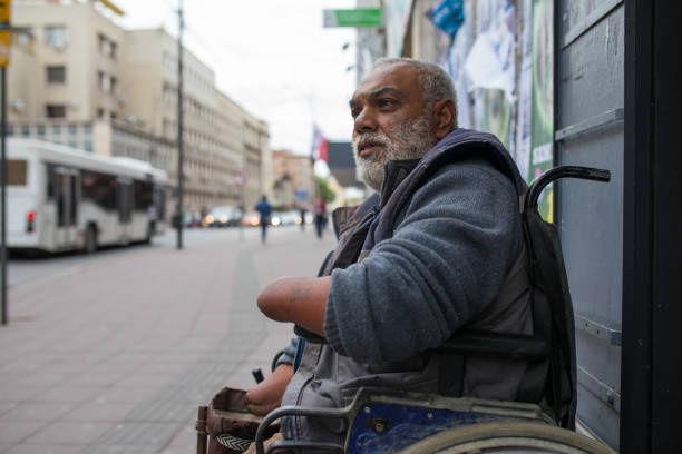 Poor disabled man asked money on street Poor disabled man asked money on street begging currency beggar poverty stock pictures, royalty-free photos & images