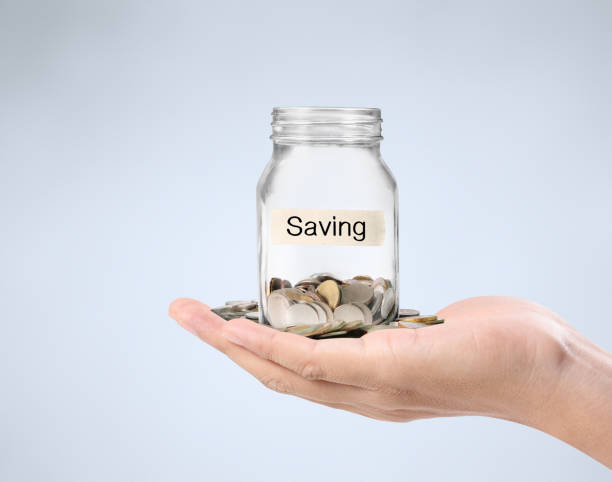 istock glass piggy  bank from  hand 860137646