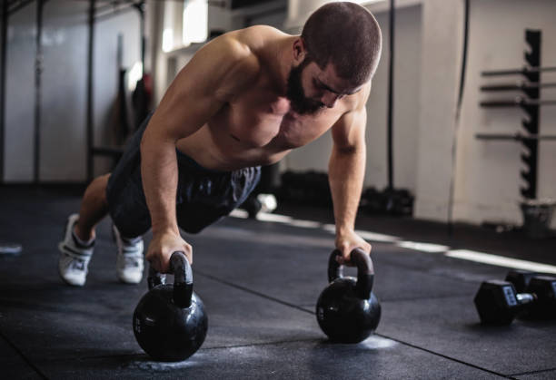 istock Exercising with kettlebell in the gym 860144692
