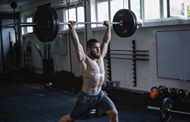 istock Strong man exercising in gym 860145170