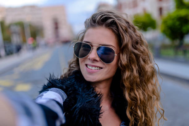 istock Young woman taking a selfie 860146270