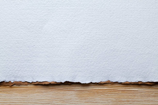 White paper sheet on wooden planks stock photo