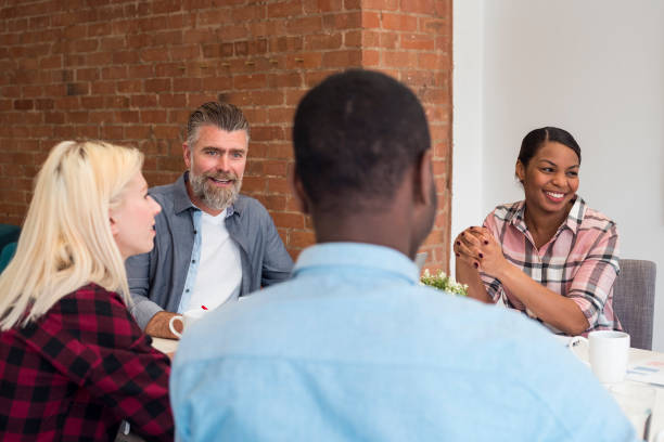 istock Cheerful business team in the office 860164252