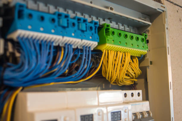 istock Close-up of electrician work on a industrial panel mounting and assembling new wiring 860165552