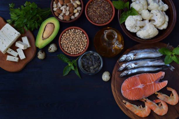 istock Composition of products containing unsaturated fatty acids Omega 3 - fish, nuts, tofu, avocado, eggs, soybeans, flax, pumpkin seeds, cauliflower, dill, vegetable oil. Top view. Healthy food 860168084