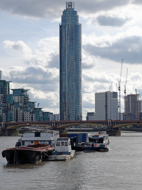 istock Scene on the river Thames in London dominated by modern development 860169582