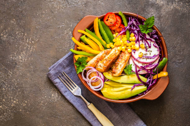 istock Grilled chicken, cabbage, pepper, avocado, tomato, greens, buddha bow 860172904