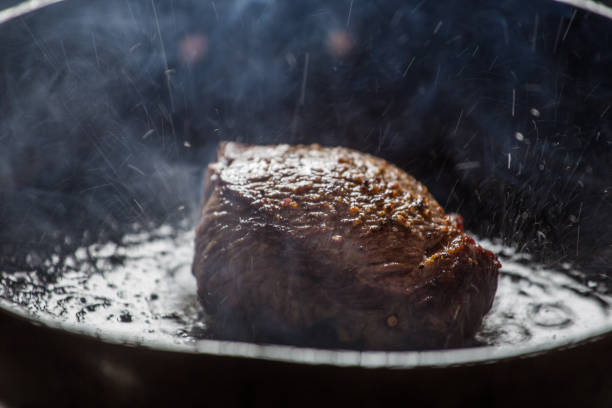 istock Piece of steak being fried in a pan. 860175468
