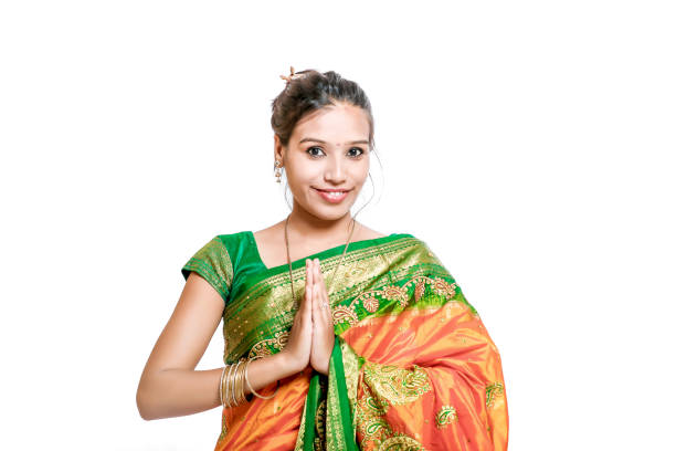 Beautiful Indian woman wearing Saree over blurred background