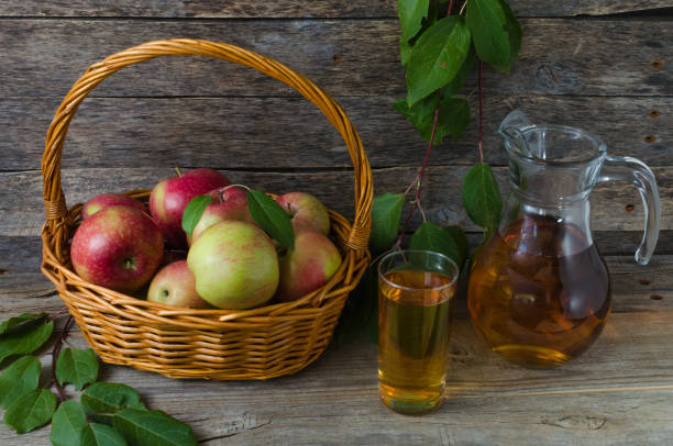 istock Red apples in a basket Apple juice in the pitcher 860179422