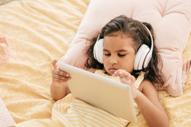 istock Girl watching a lesson on digital tablet 860191424
