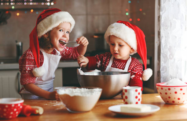 istock happy children bake christmas cookies 860209376