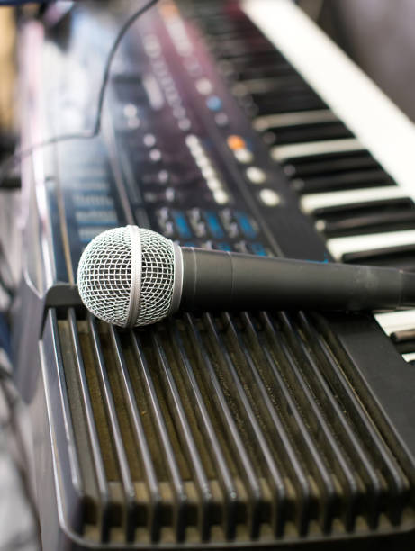 istock Microphone and electronic keyboard. Are isolated on a white background. 860214026