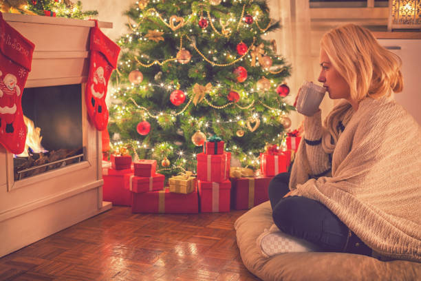 istock Young Girl Drinking Tea on Christmas Eve 860216766