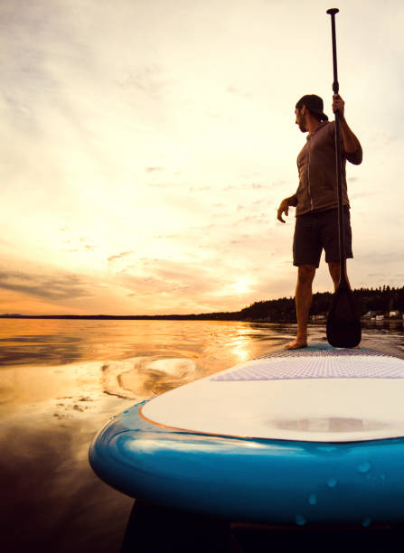 istock Man Riding Paddleboard on Puget Sound At Sunset 860217762