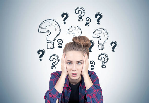 istock Stressed teen girl, question marks 860218096