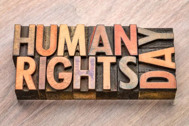 Human Rights Day (10 December)  - handwriting on a napkin with a cup of coffee Day (10 December)  - word abstract in vintage letterpress wood type blocks