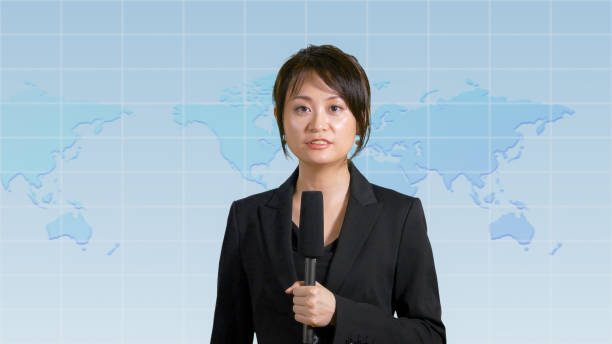 istock Female news anchor in studio 860224304