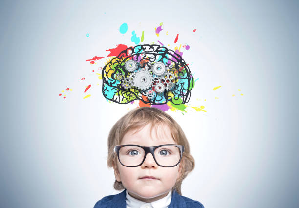 istock Cute baby boy in glasses, brain cogs 860224586