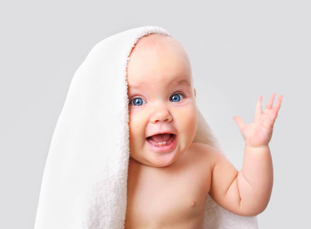 istock Baby in towel isolated. 860231776