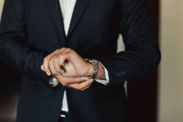 istock The man fastens the watch on his hand 860231912