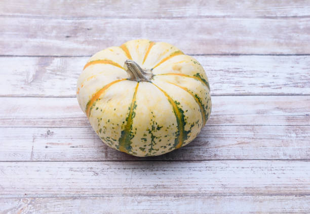 istock Pumpkin on wood floor 860235050