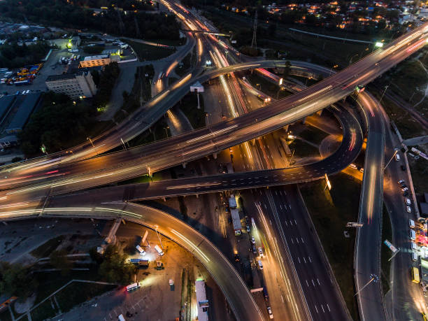 istock Traffic on freeway interchange. Aerial night view city traffic. 860239694