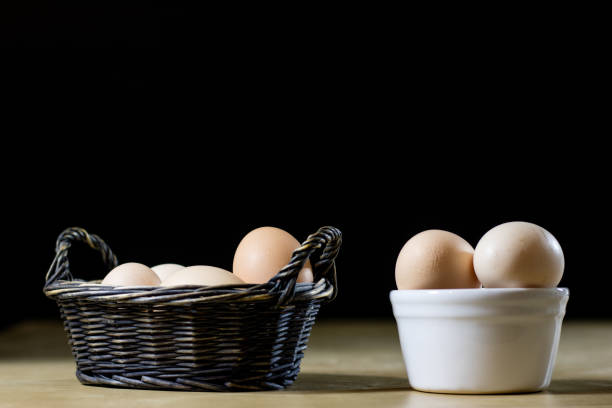 istock Egg, milk and jug on the kitchen table. Kitchen table with food products. Black background. 860242442