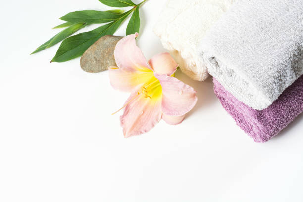 istock Spa setting of towel, flower isolated on white background with copy space. 860242836