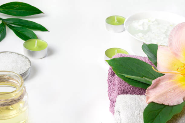 istock Spa setting of towel, flower on white background with copy space. 860242898