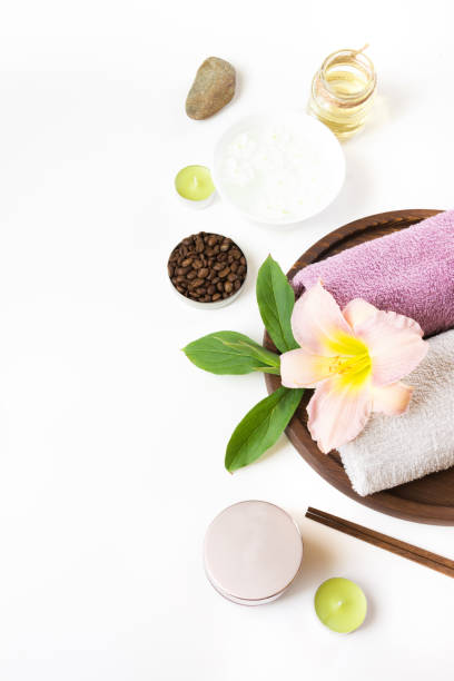 istock Spa setting of towel, flower, coffee on white background with copy space. 860243048