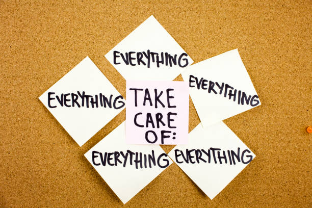 istock A yellow sticky note writing, caption, inscription The words Take Care in red text on a white sticky note pinned to a cork notice board as a reminder 860243270